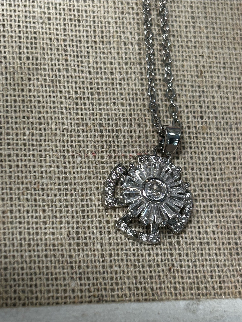 Silver tone Crystal Sunburst Pendant Spinner Necklace